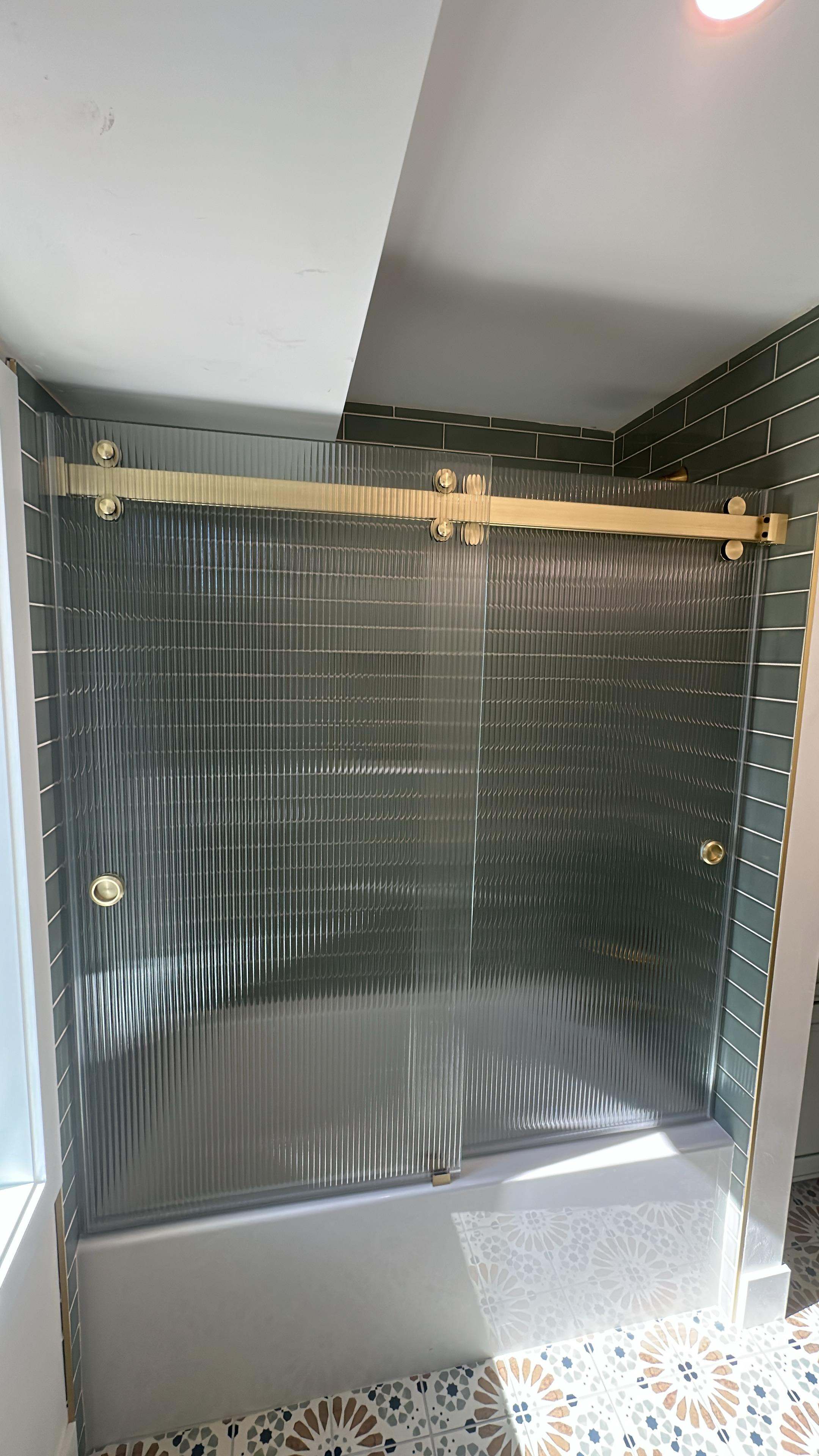Fluted Glass & Gold Tub Door — Showers in Venice, FL